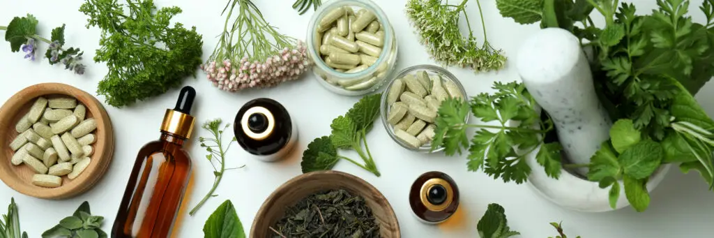 Concept of herbal medicine pills on white background, top view | Holistic Wellness & Psychiatry